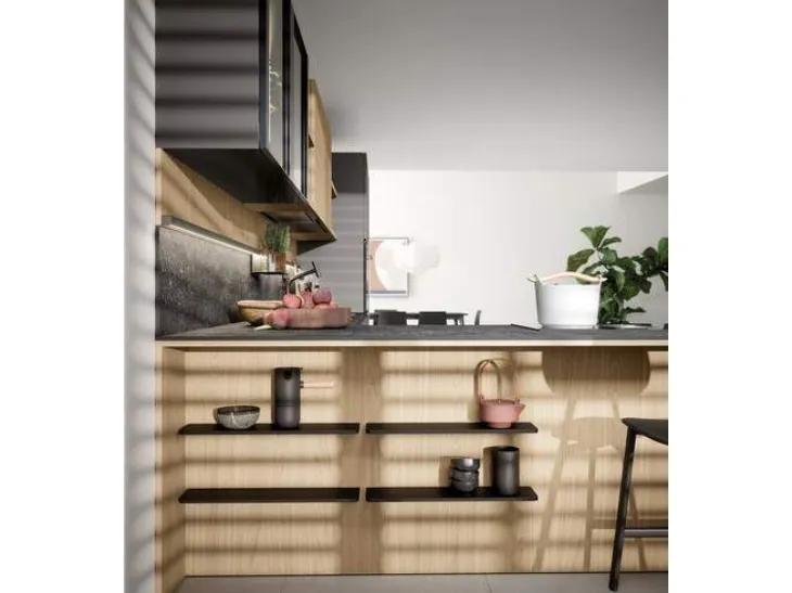 Cucina con penisola dai toni moderni e scuri